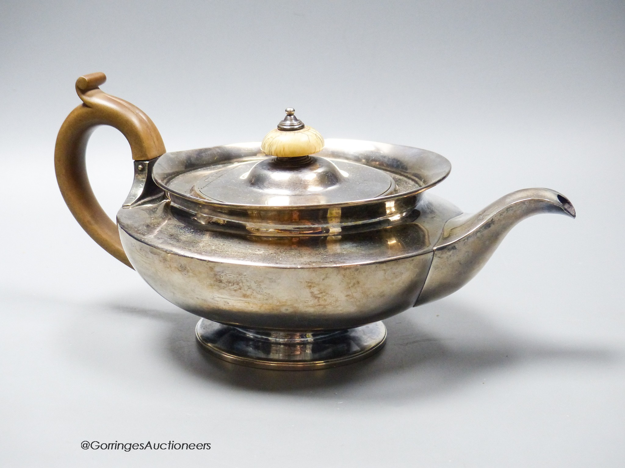 A George IV silver squat circular teapot by William Eley II, London, 1826, gross 23oz.